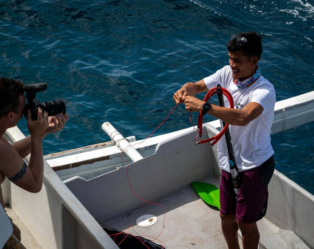 A crew filming from the deck of a boat