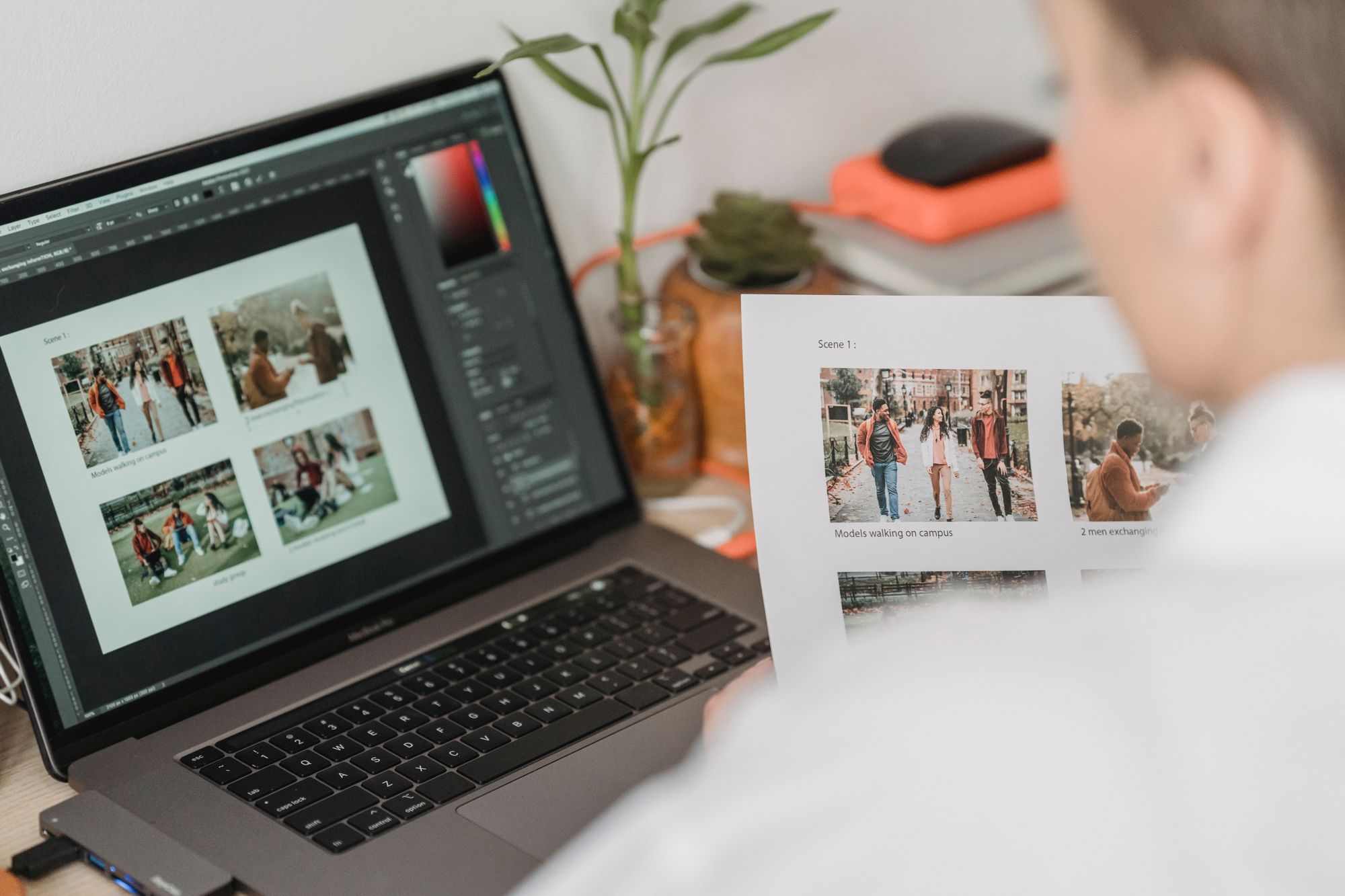 Printed proofs beside a laptop during a final review